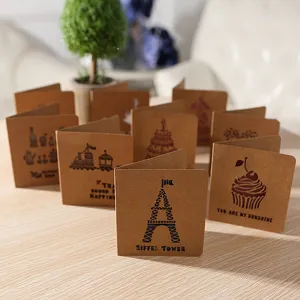 Cartes de vœux en papier kraft vintage découpées au laser, design délicat pour cadeaux.