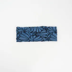 Blue abstract floral headband detail showing soft cotton fabric stretch and wide band design.