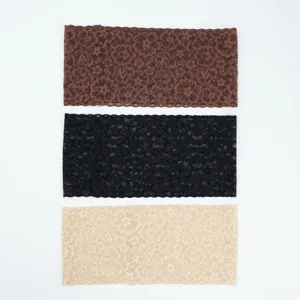 Detail view of elastic wide lace hair band with floral design, comfortable daily wear accessory.