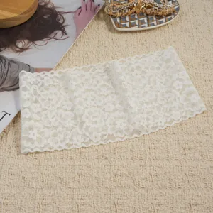 Close-up detail of the white lace headband, showing delicate floral pattern and elastic fabric.