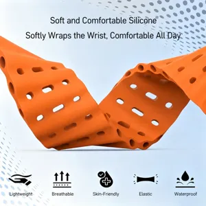 Close up detail view of orange silicone watch strap featuring breathable holes and wavy texture.