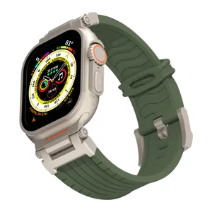 Green silicone strap and titanium-colored protective case compatible with Apple Watch Ultra.
