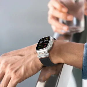 Closeup of rugged silicone watch band with metal connectors for Apple Watch Ultra active look.