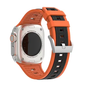 Detailed view of the orange and black silicone watch strap with metal buckle, durable texture.