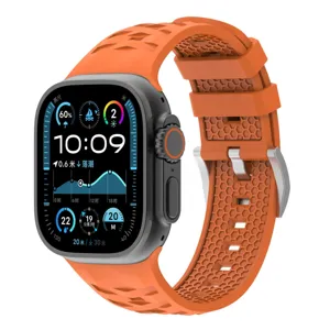 Orange silicone watch strap replacement with titanium metal buckle and textured pattern details.