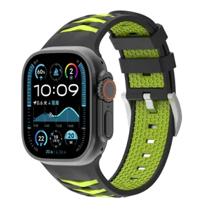 Detailed view of the black and green silicone watch strap with honeycomb tire texture design.
