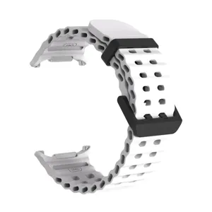 Rugged perforated silicone replacement watch band compatible with smartwatches, comfortable daily wear.