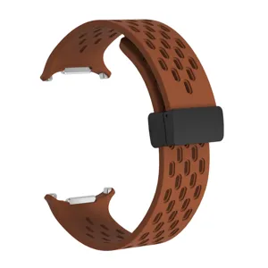 Brown silicone magnetic watch strap with breathable perforated design for smart watch replacement loop.