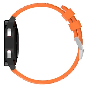 Detailed side view of the orange silicone watch strap with metal buckle, durable fit.