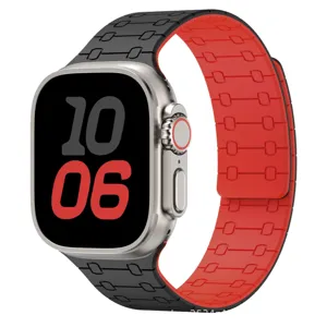 Close-up of magnetic silicone watch band, dual-color black and red design with durable texture.