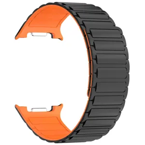 Black and orange magnetic silicone watch band featuring a segmented design for smart watches.