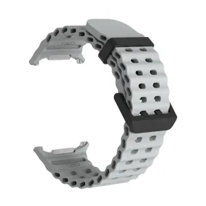 Close-up of the grey breathable silicone watch strap with secure loop and metal connector.