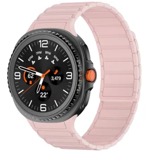 Pink magnetic silicone watch band detail view, showing flexible strap structure and texture.