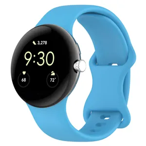 Blue silicone replacement watch strap detail, soft and durable material with butterfly buckle.