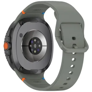 Detailed view of the replacement silicone watch strap with secure buckle and size markings.