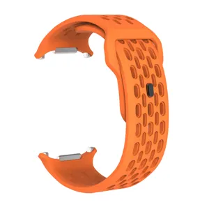 Orange silicone watch band with breathable holes, flexible replacement strap for smartwatches.
