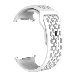 Detailed view of white silicone perforated watch strap with secure buckle and metal connectors.