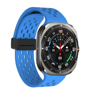 Silicone replacement strap for smartwatch with blue perforated design and secure magnetic buckle.