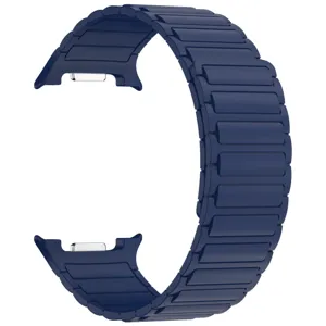 Close-up detail of dark blue silicone magnetic watch band with metallic connectors for smartwatches.