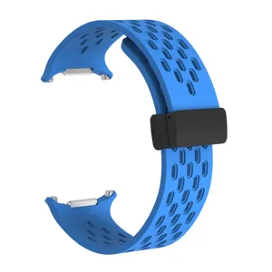 Detailed view of the blue silicone replacement watch strap with breathable perforated ventilation holes.