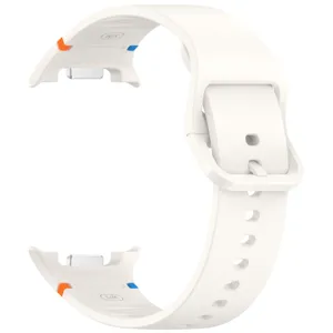 Close-up detail view of white silicone smartwatch replacement band with secure buckle.