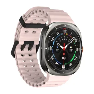 Pink perforated silicone watch strap detail, breathable multi-hole replacement band for smart watch.