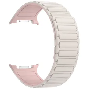 Silicone magnetic watch band detail view, showcasing pink and white dual tone design.