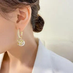 Elegant bow pearl hoop earrings for women, chic zircon gold plated jewelry gift for daily wear.