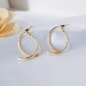 Detailed shot of minimalist metal curved C-shaped earrings with S925 silver needles for women.