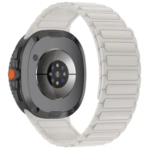 Smartwatch with white magnetic silicone strap, rugged case and orange button for daily wear.