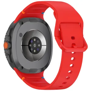 Silicone watch strap detail view, red band with orange button and back sensor casing.