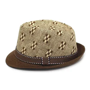Detailed view of the stylish woven straw fedora hat, showcasing unique pattern and brim.