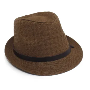 Detail view of the brown woven paper straw fedora hat with geometric pattern and dark band.