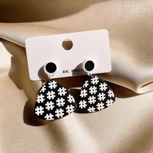Black and white geometric checkered earrings with silver needle retro vintage minimalist style.