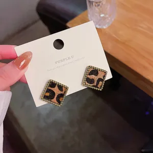 Vintage leopard print square stud earrings, gold twist edge, elegant jewelry detail