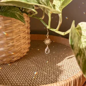 Gold sun catcher crystal teardrop pendant for plant decoration and home window hanging decor.