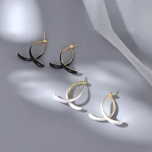 Minimalist metal curved C-shaped stud earrings featuring a chic and stylish design.