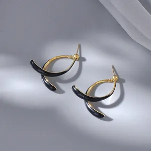 Elegant gold and black curved c-shape drop earrings for women, stylish modern ear jewelry.