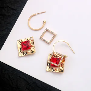 Gold red crystal square hoop earrings detail shot, geometric rhinestone chic jewelry parts.