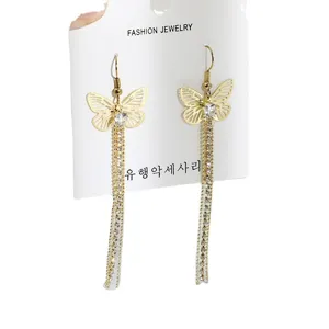 Golden butterfly rhinestone tassel earrings for women, elegant long dangling fashion jewelry.