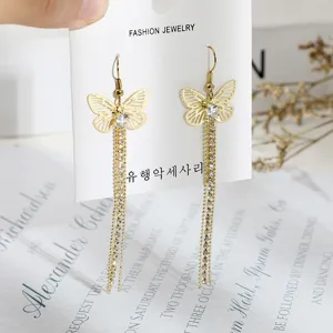 Elegant gold butterfly rhinestone tassel earrings, stylish long dangle jewelry for women.