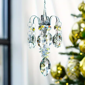 Detailed shot of sparkling crystal suncatcher hanging ornament with faceted chandelier prisms.