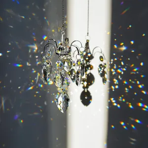 Crystal chandelier suncatcher detail showing beautiful rainbow light refractions on wall.