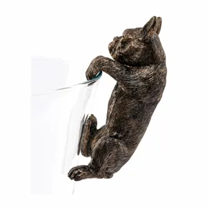 Detailed close-up shot of bronze French bulldog planter buddy pot hanger garden decor.