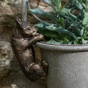 Close-up detail of the charming bronze French bulldog pot hanger, perfect for garden decor.