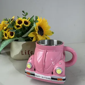 Pink beetle shaped coffee mug with stainless steel inner liner, perfect gift for coffee lovers.