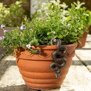 Bronze snake flowerpot hanger detail showing realistic reptile texture and coiled garden decor design.