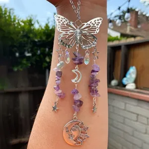 Crystal butterfly suncatcher pendant with amethyst chips and moon charm for garden decoration.