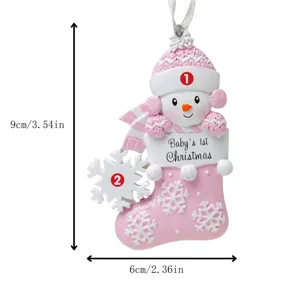 Pink resin snowman Christmas stocking ornament with snowflake detail and baby's 1st holiday text.