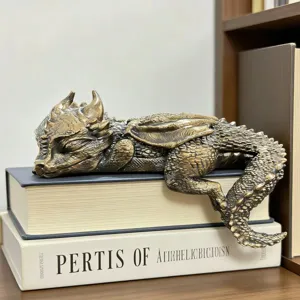 Detailed view of a resin sleeping dragon figurine, perfect fantasy desktop bookshelf decor.